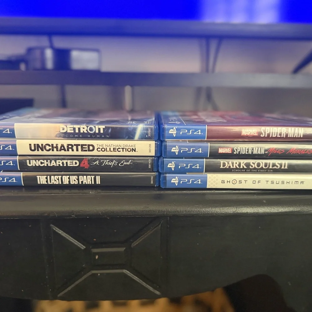 Sony PlayStation 4 with 2 Controllers and 8 Games